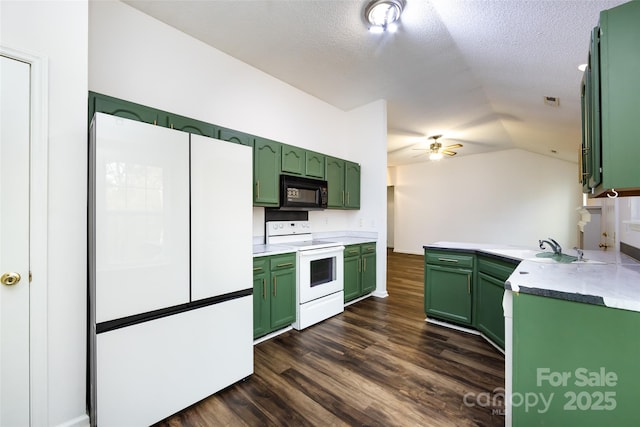 kitchen with white appliances, green cabinetry, a textured ceiling, and lofted ceiling