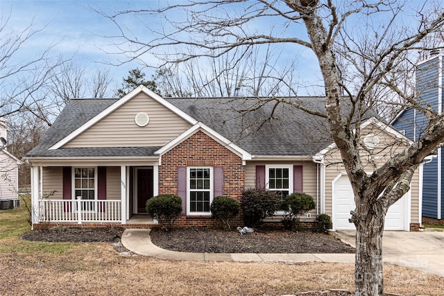 view of front of property with a porch and a garage