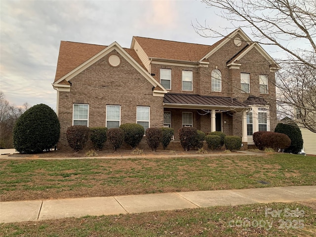 view of front of house with a front lawn