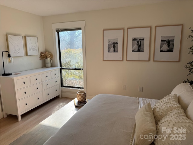 bedroom with light hardwood / wood-style floors