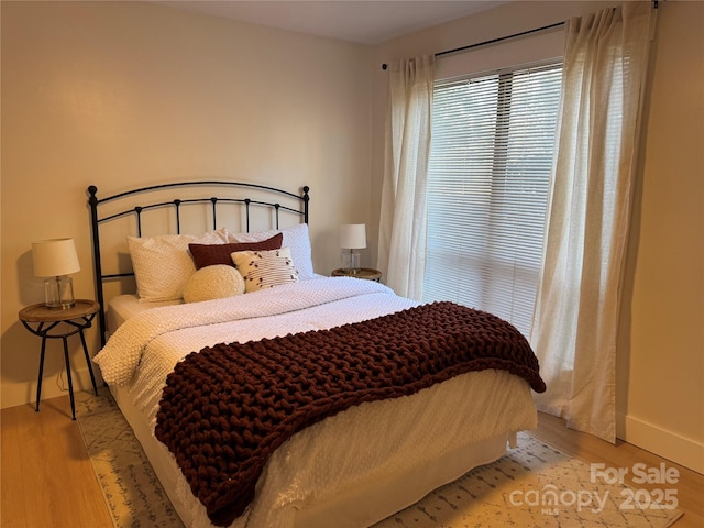 bedroom with light wood-type flooring