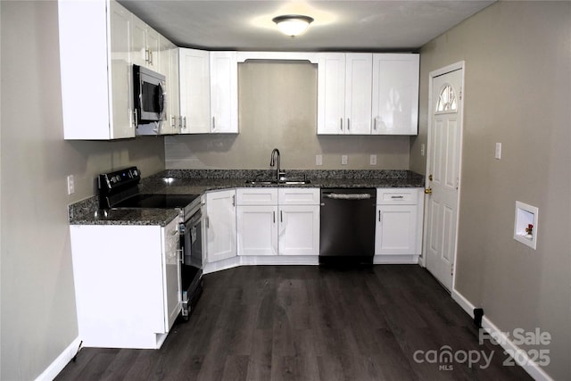 kitchen with sink, white cabinets, dark stone counters, and appliances with stainless steel finishes