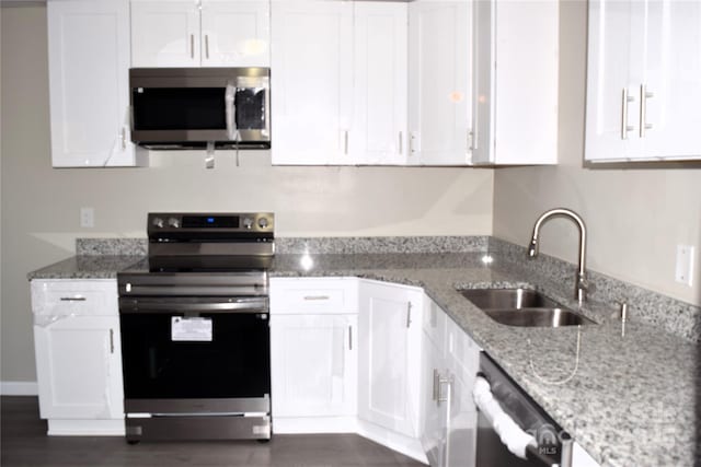 kitchen with white cabinets, sink, and appliances with stainless steel finishes