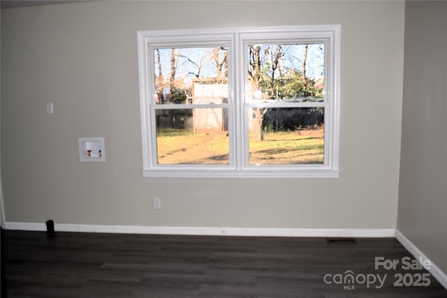 empty room with dark hardwood / wood-style floors