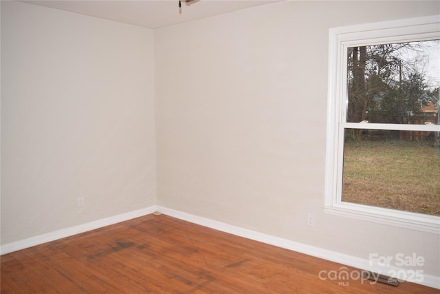 spare room featuring hardwood / wood-style floors