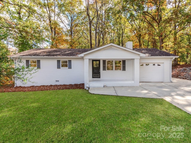 ranch-style home with a front lawn and a garage