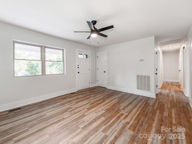 unfurnished room with ceiling fan and light wood-type flooring