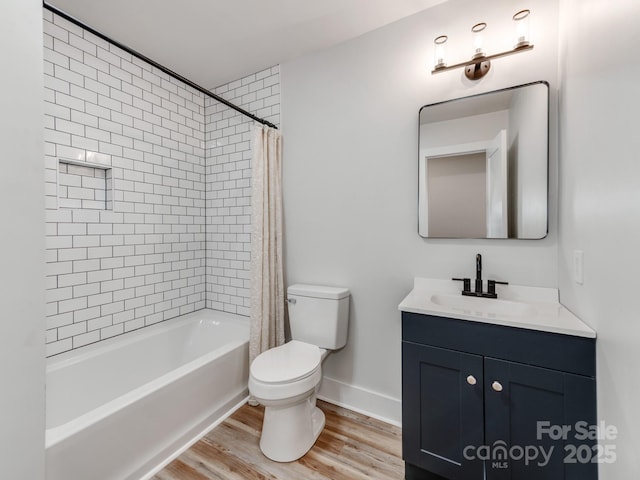 full bathroom featuring shower / bath combo with shower curtain, toilet, vanity, and wood-type flooring