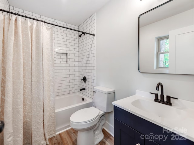 full bathroom with toilet, vanity, shower / bath combination with curtain, and hardwood / wood-style flooring