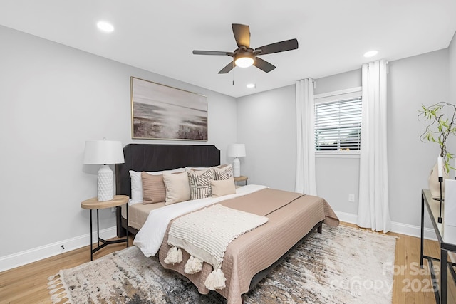 bedroom featuring hardwood / wood-style flooring and ceiling fan