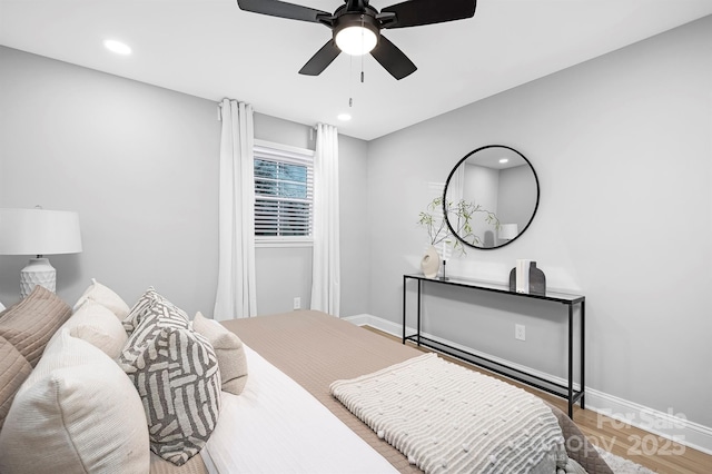 bedroom featuring hardwood / wood-style flooring and ceiling fan