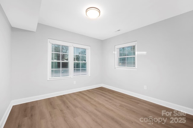 unfurnished room featuring light hardwood / wood-style flooring