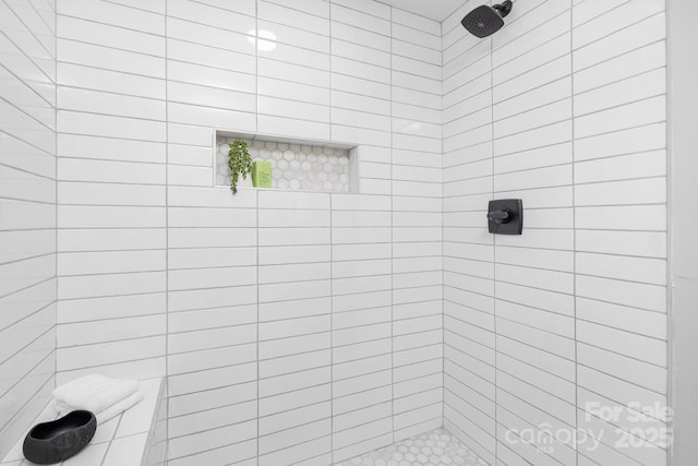 bathroom featuring a tile shower