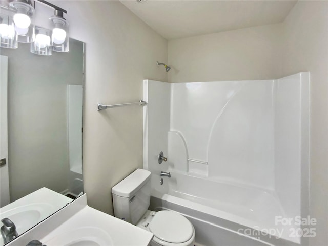 full bathroom with vanity, toilet, and shower / tub combination