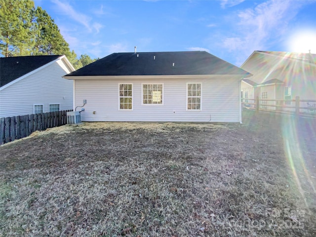 back of property featuring central AC unit