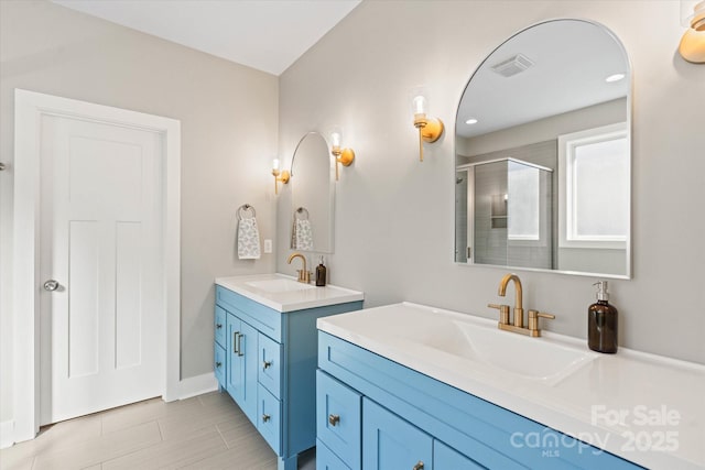 bathroom with walk in shower and vanity