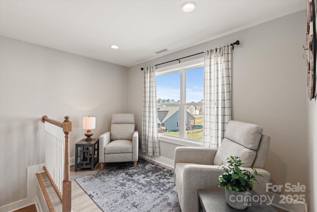 living area featuring hardwood / wood-style floors