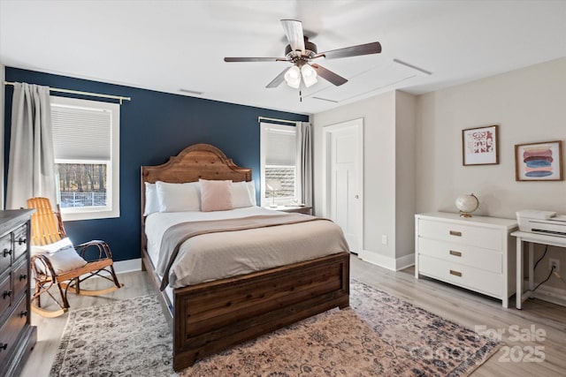 bedroom featuring ceiling fan and light hardwood / wood-style floors