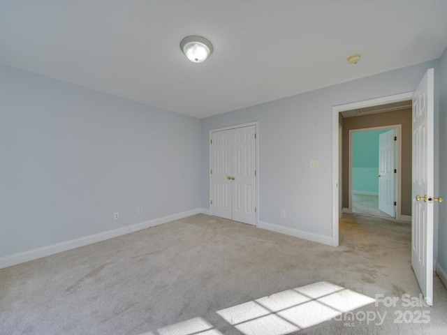 spare room with light colored carpet