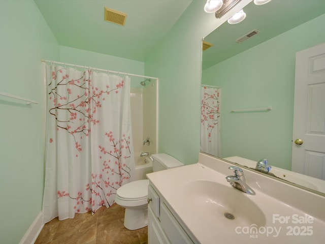 full bathroom with vanity, shower / tub combo, and toilet