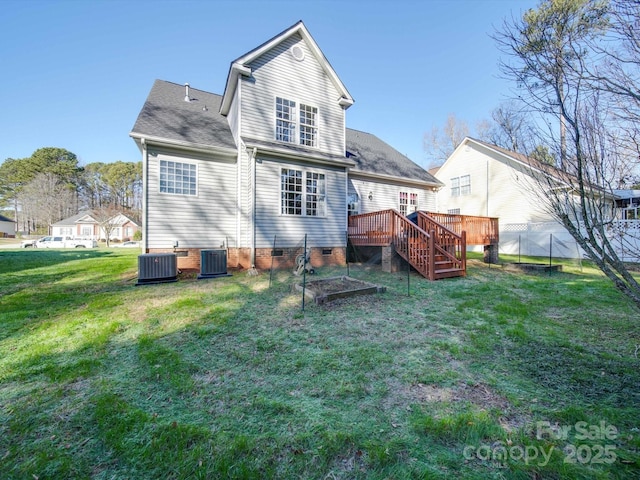 back of property featuring a deck, central air condition unit, and a yard