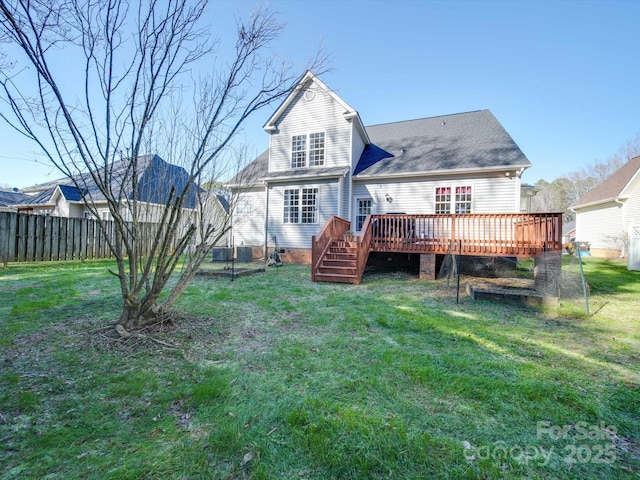 back of house with a lawn and a wooden deck