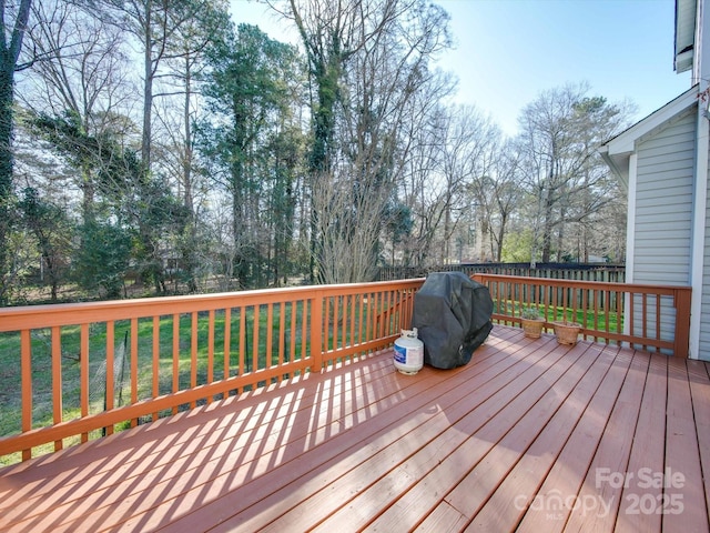 wooden deck with area for grilling