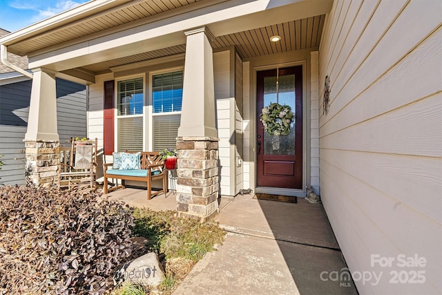 doorway to property with covered porch