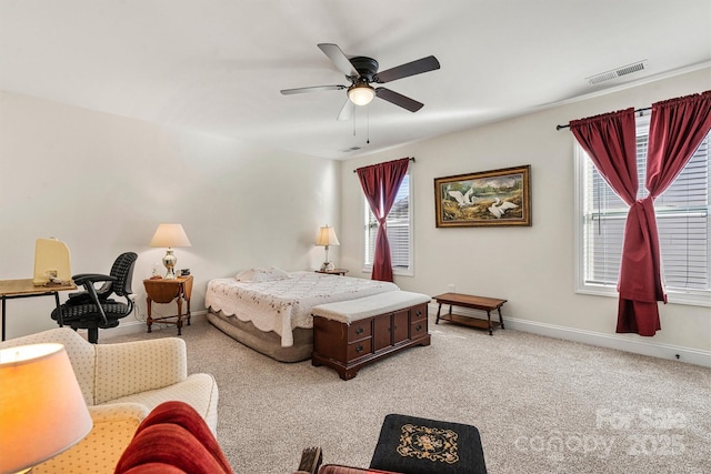 bedroom featuring light colored carpet and ceiling fan