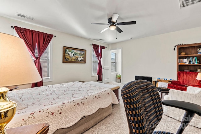 bedroom featuring multiple windows, carpet, and visible vents