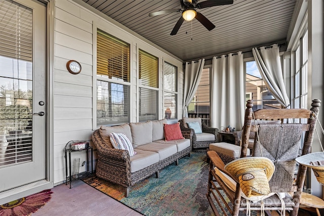 sunroom with wooden ceiling and ceiling fan