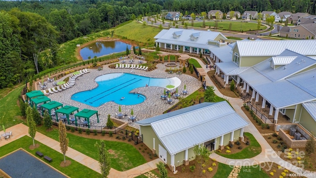 birds eye view of property with a residential view and a water view