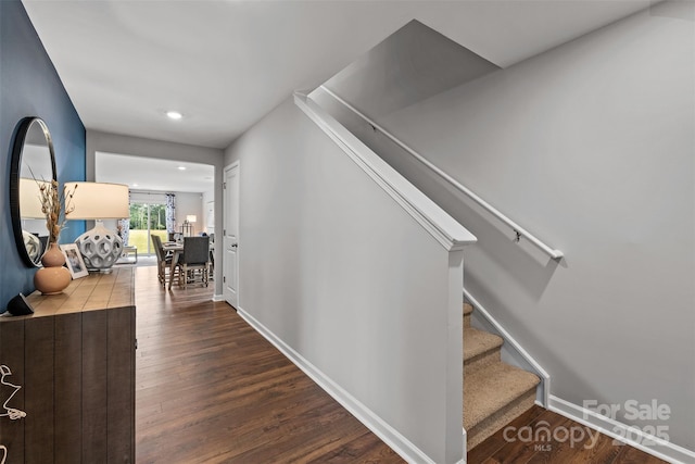 stairs with hardwood / wood-style flooring