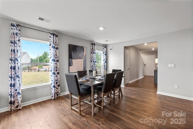 dining room featuring dark hardwood / wood-style floors and plenty of natural light