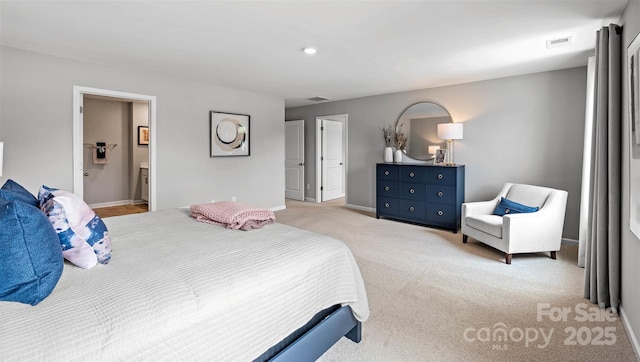 carpeted bedroom with ensuite bathroom