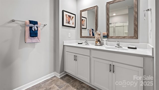 bathroom featuring vanity and a shower with door