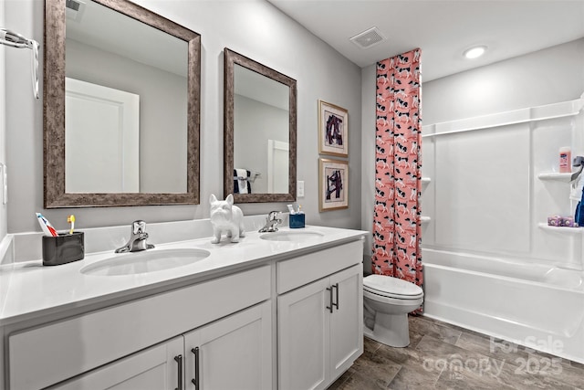 full bathroom with shower / bath combo with shower curtain, vanity, and toilet