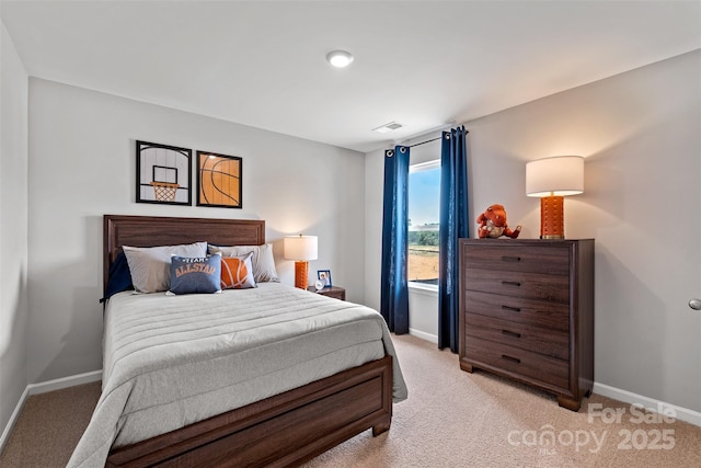 bedroom featuring light colored carpet