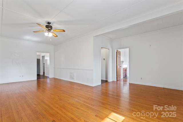 unfurnished room featuring hardwood / wood-style floors, ceiling fan, and ornamental molding