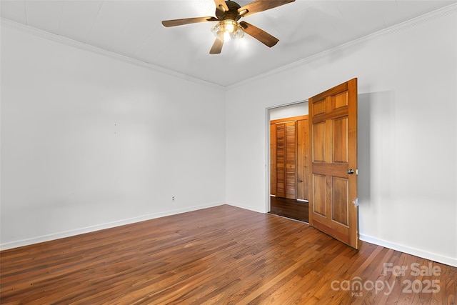 unfurnished room with hardwood / wood-style floors, ceiling fan, and crown molding