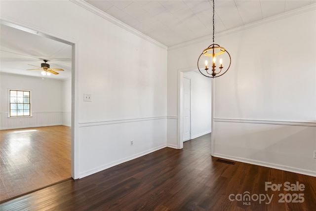 unfurnished room with crown molding, ceiling fan with notable chandelier, and dark hardwood / wood-style floors