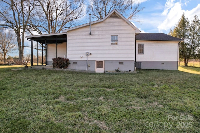 view of home's exterior featuring a lawn and cooling unit