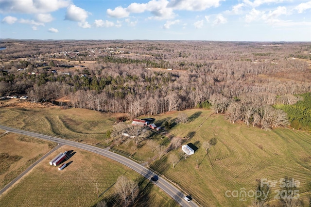 birds eye view of property with a rural view