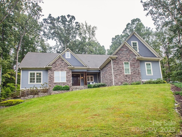 craftsman inspired home with a front yard