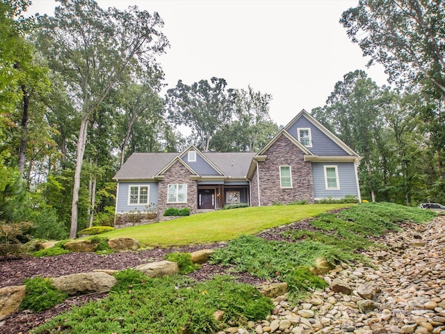 craftsman-style house with a front lawn