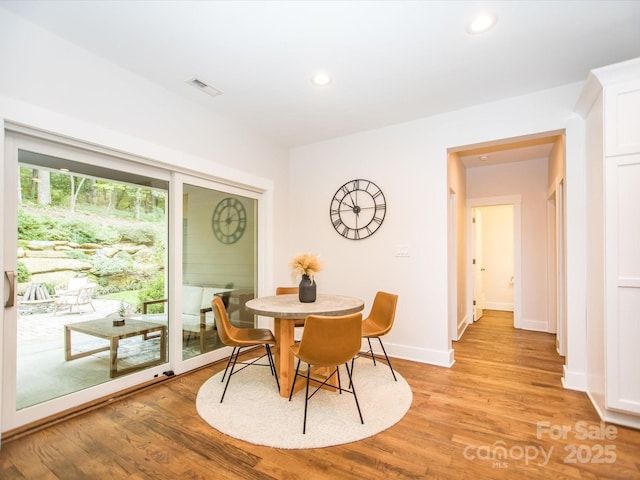 dining space featuring light hardwood / wood-style flooring