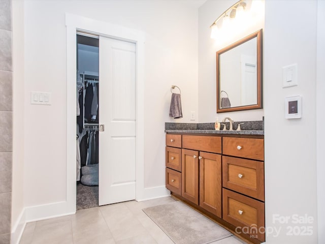 bathroom with tile patterned flooring and vanity