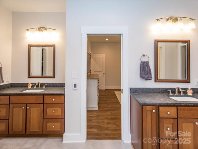 bathroom featuring tile patterned flooring and vanity