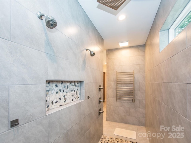 bathroom with a tile shower