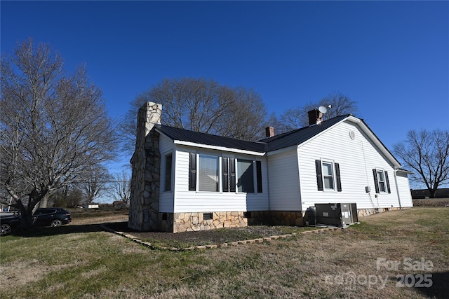 view of home's exterior with a lawn